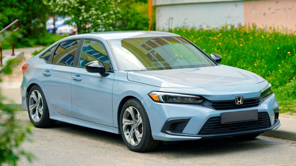 Honda Civic 11th generation parked in residential area