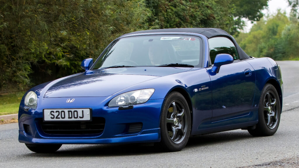 2002 blue Honda S2000 car travelling on an English country road