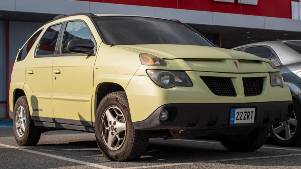 Yellow 2003 Pontiac Aztek parked in a lot