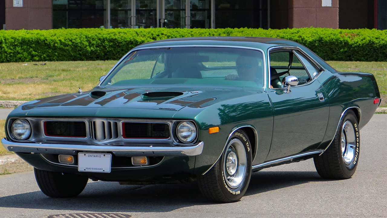 1280px 1973_Plymouth_'Cuda_in_Forest_Green_Metallic,_front_left_(Queen_Street_2023)