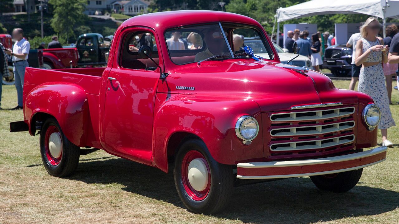 1953 Studebaker 2R5 half-ton truck in Cherokee Red at the 2022 Greenwich Concours d'Elegance. Second owner since new! Deluxe cab, including such sybaritic pleasures as heater, interior lights, and two outside mirrors.