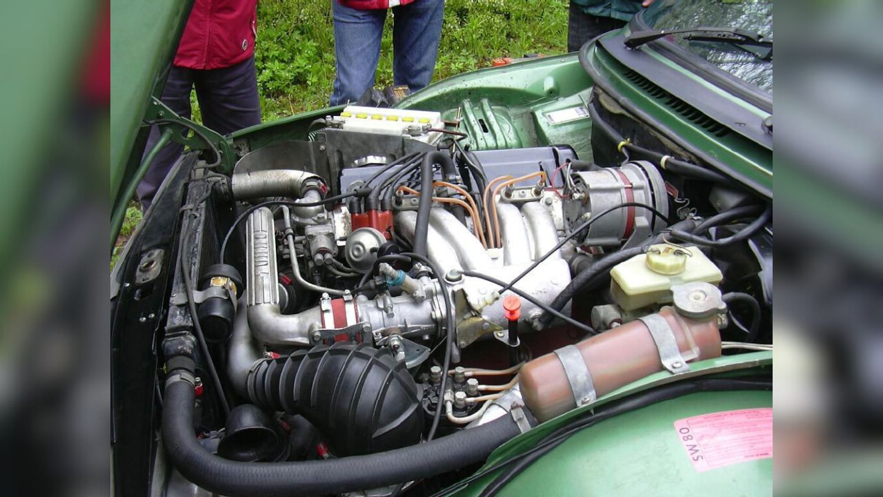 The engine in a 1980 SAAB 99 Turbo. Notice the turbo logo and the heat protection around the battery