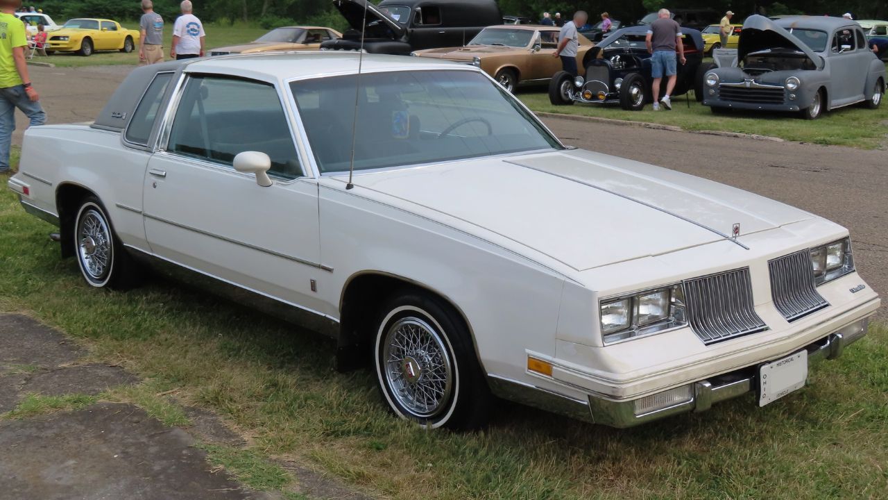 1984 Oldsmobile Cutlass Supreme Brougham Coupe, front right (Cruisin' the River Lowellville Car Show, June 19th, 2023)