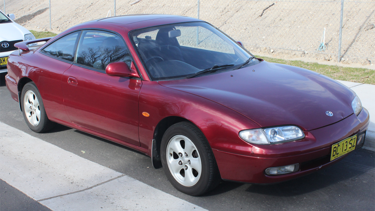 1992_Mazda_MX-6_(GE)_coupe_(20028616534) 1280 x 720