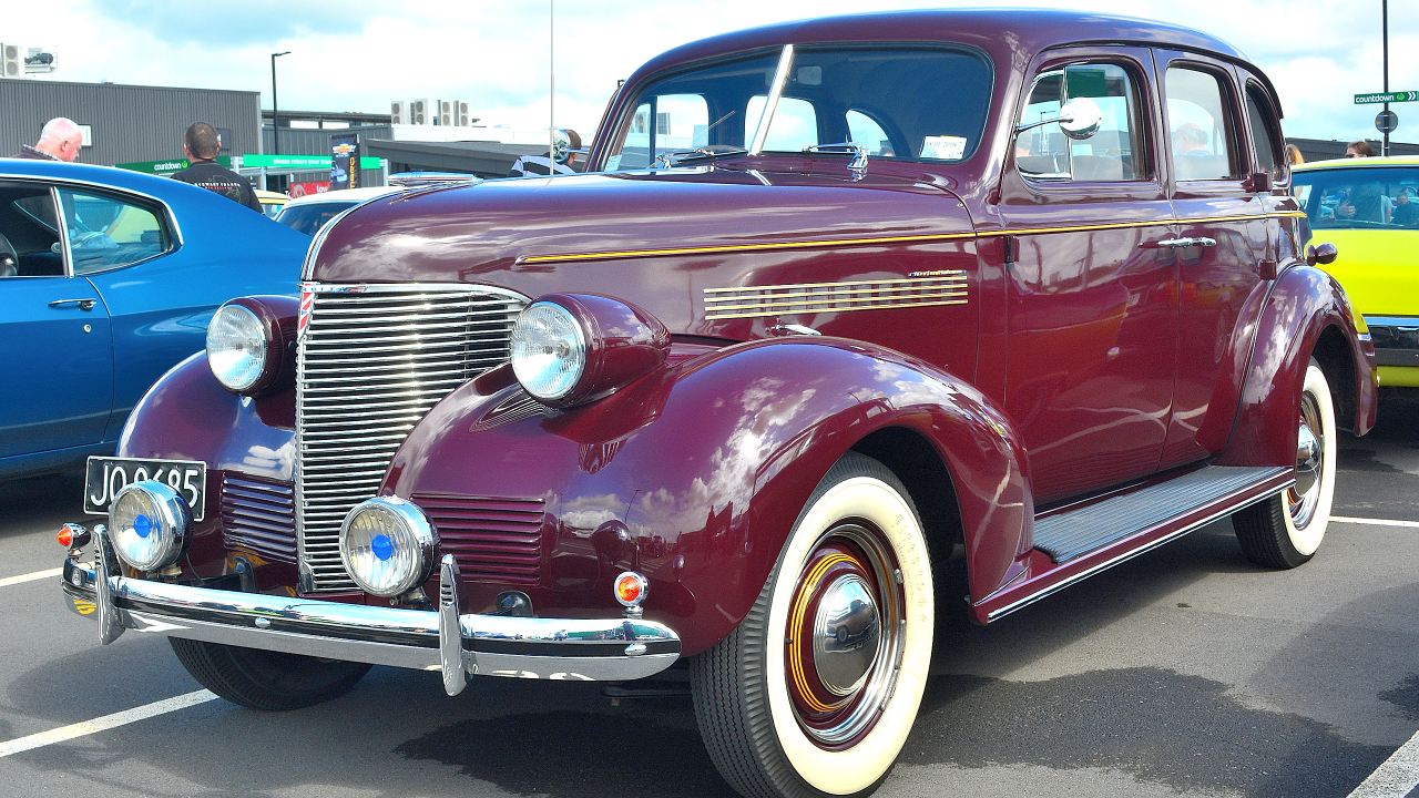 Why did classic cars have split front windshields?