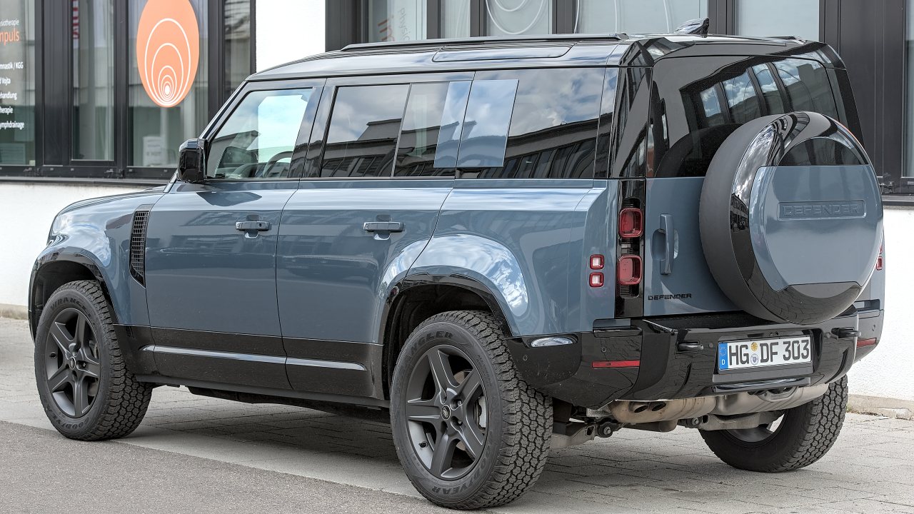 Why did some cars mount spare tires on trunks?