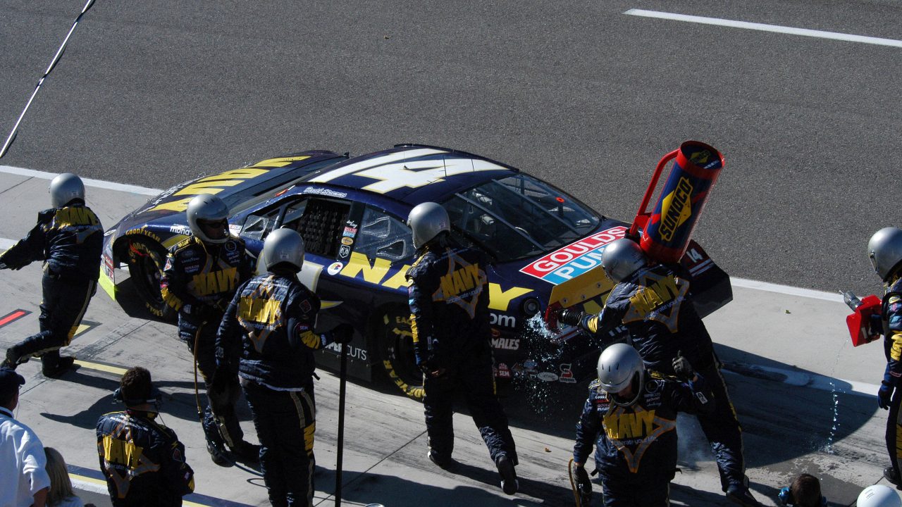 US Navy 050312-F-2575F-002 Team members of the FitzBradshaw NASCAR Busch Series Race Team works to get driver David Stremme off pit row