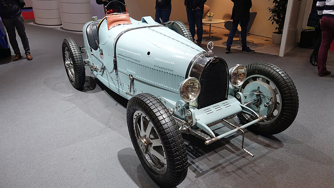 Why did some classic cars have belts on their hoods? Explained
