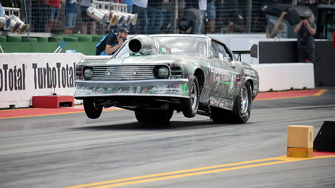 Why some drag cars pull wheelies and others don’t, explained