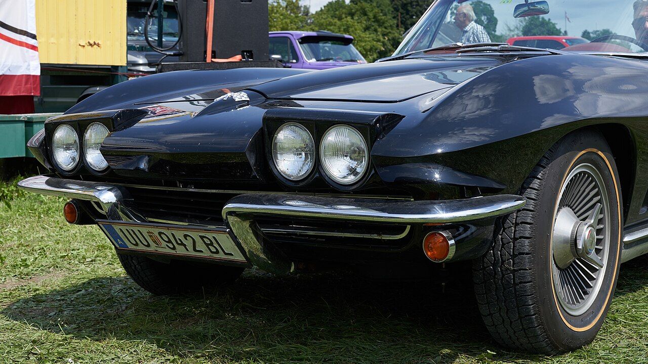 Pop up headlights turned approximately 135° along the lateral axis on a Chevrolet Corvette C2