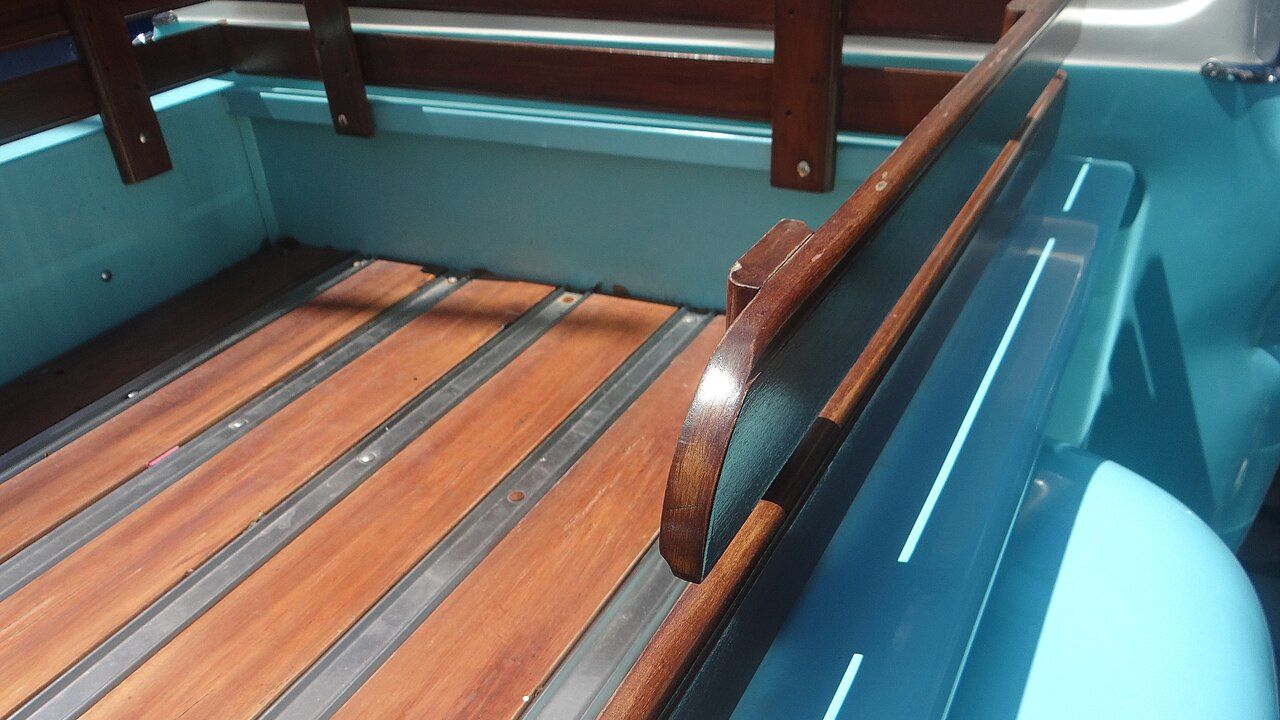 Why did classic pickups use wood bed floors?