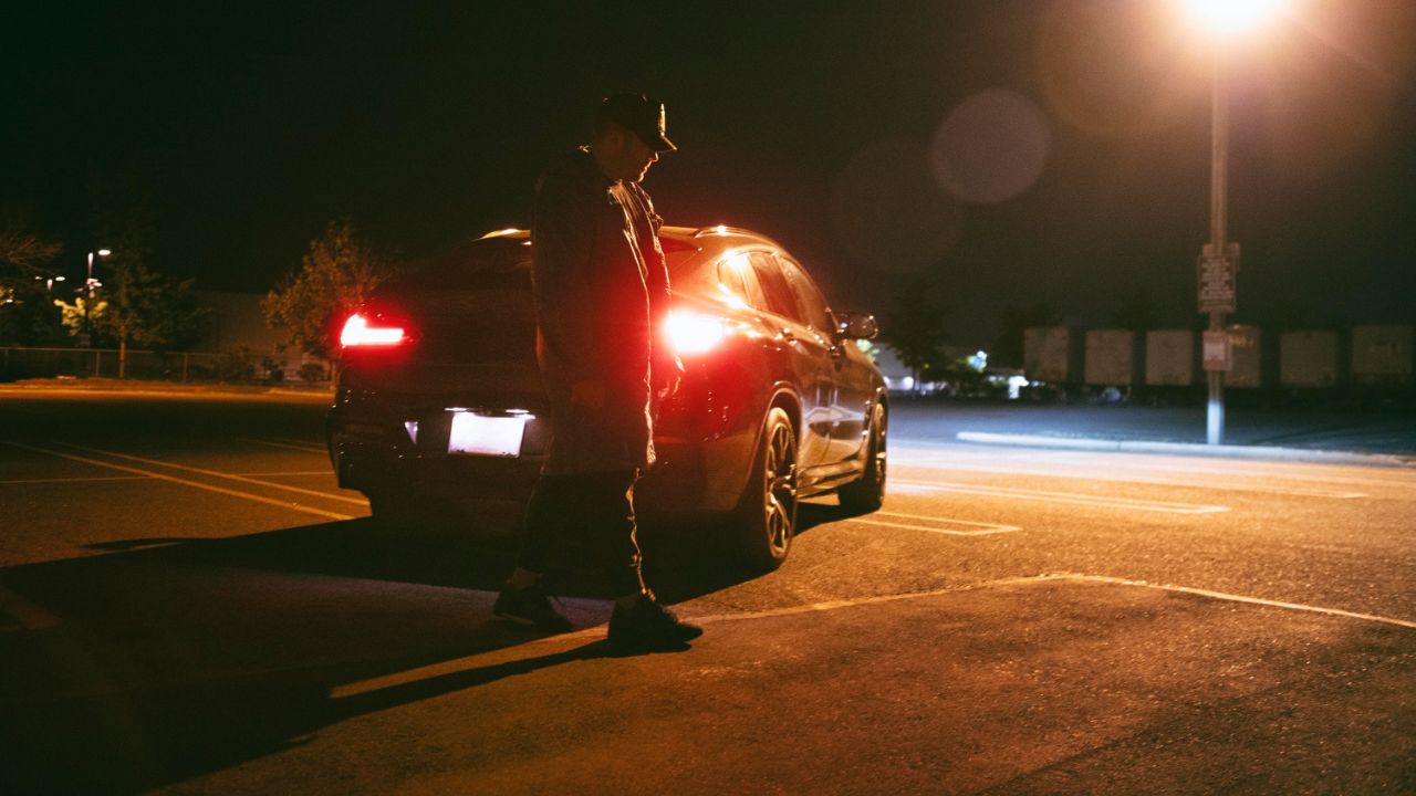 Car in dark parking lot