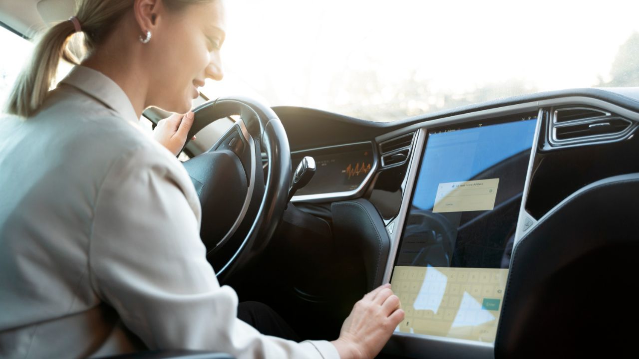 Girl using car screen while driving