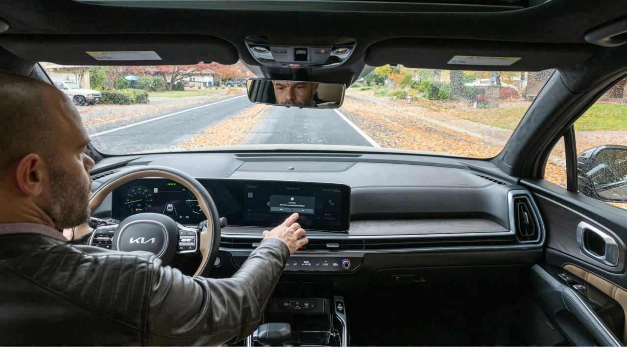 Interior of car man touching car screen