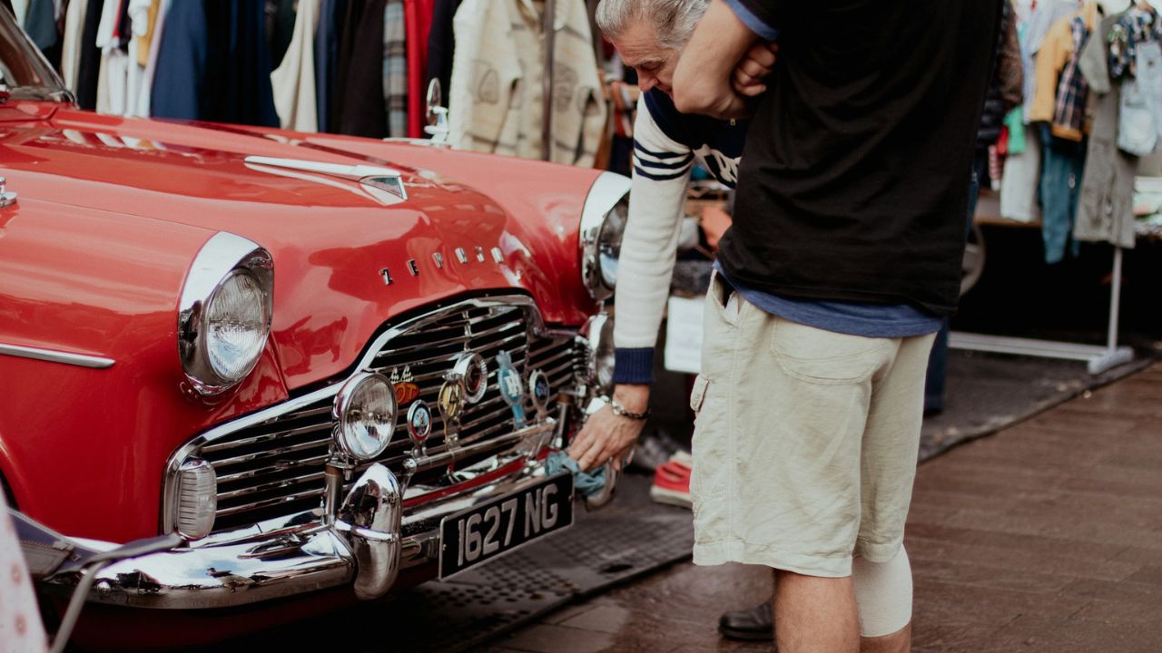 Man Checking Classic Car