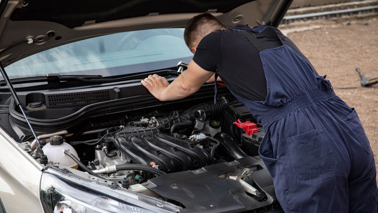 Mechanic Repairing Car