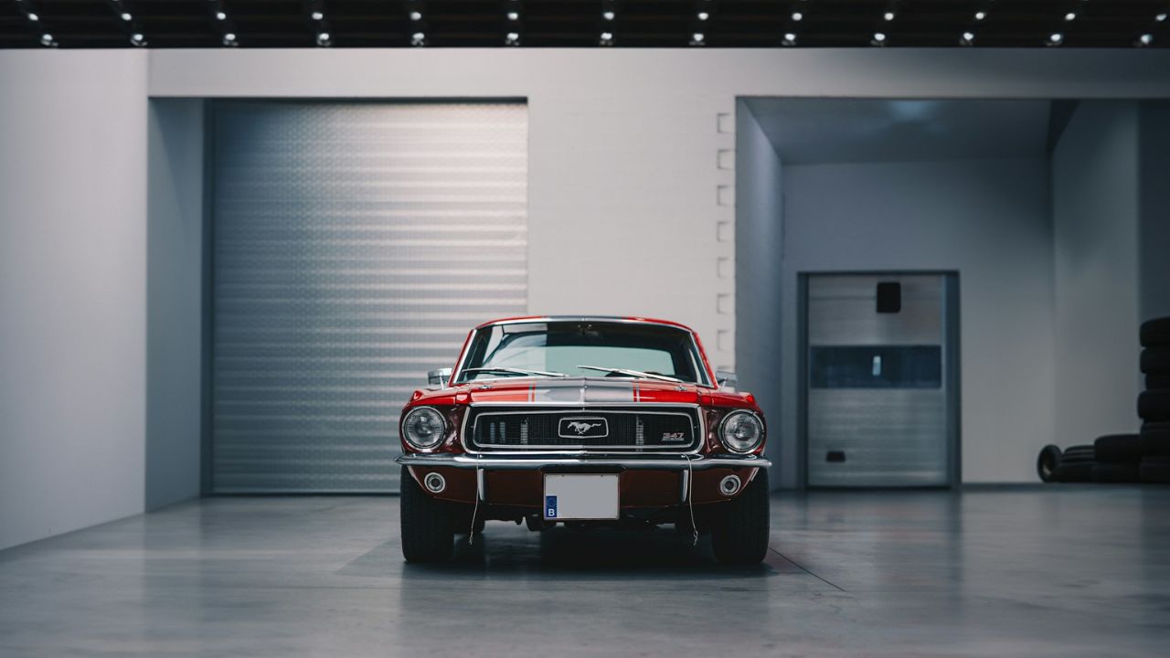 Red and Black car parked in a garage