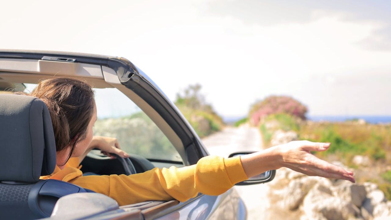 Woman Driving Classic Car