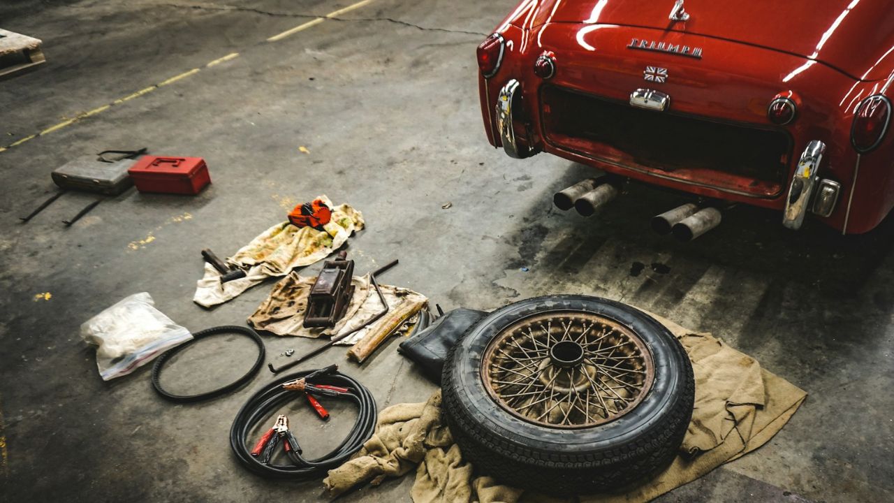 spare parts and toolkit near classic car