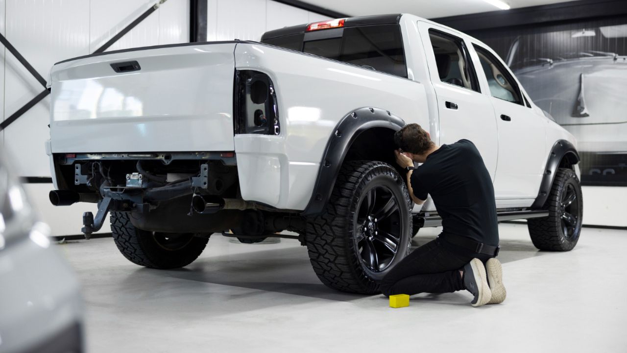 Man working on car suspension