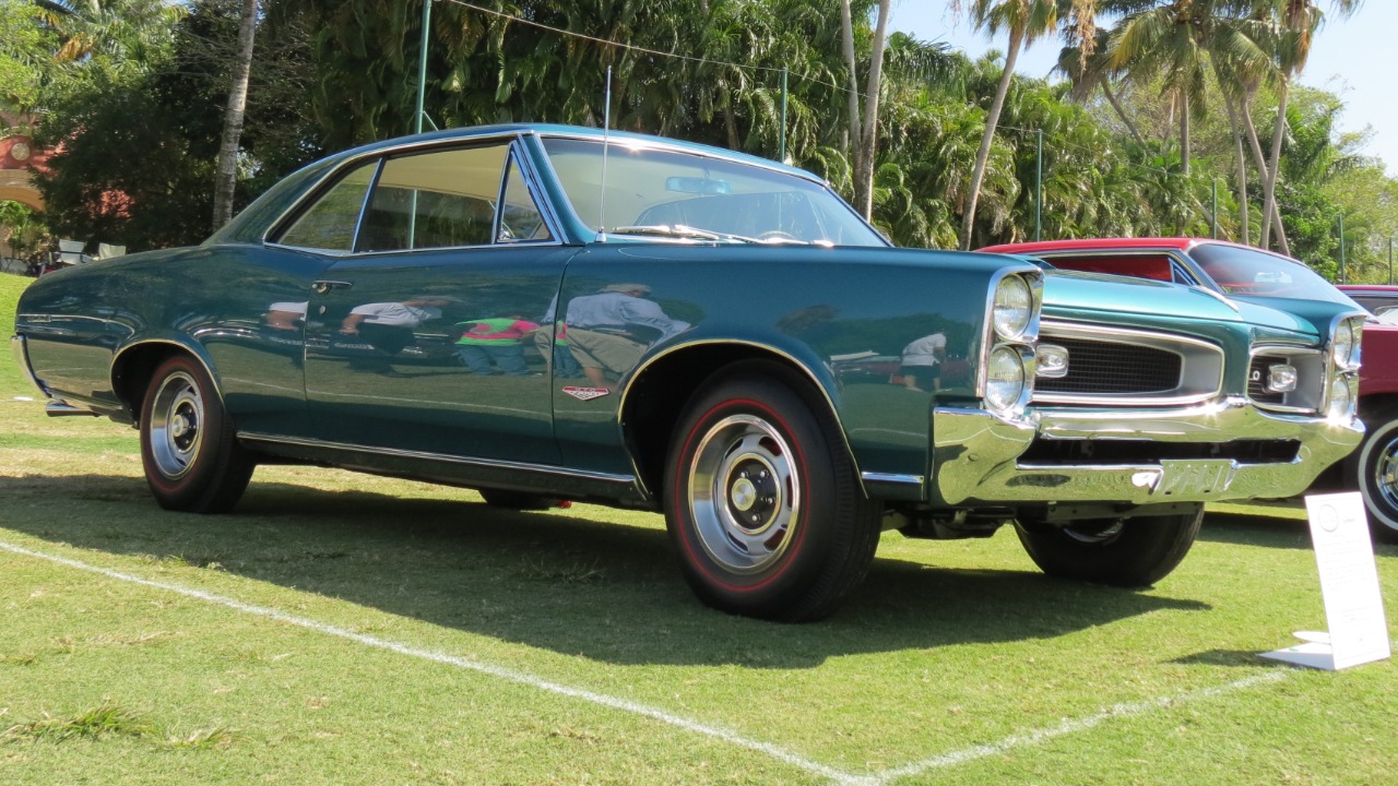 1965 GTO tri-power vs 4-barrel sparks a collector loyalty war—here’s who wins