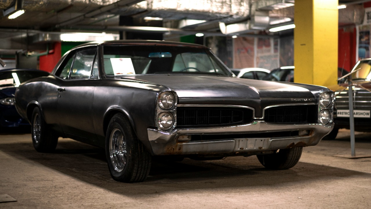 a black car parked in a garage