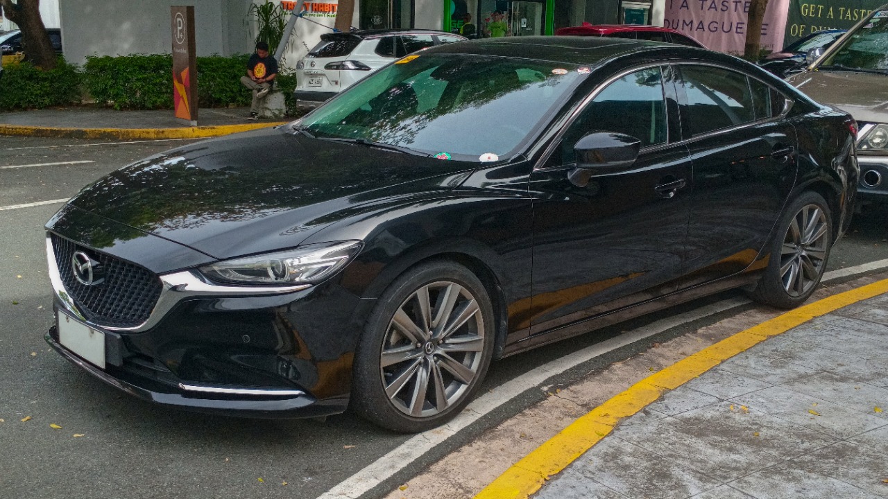 2019 Mazda6 2.5 Skyactiv-G Turbo sedan in Jet Black, front left.jpg