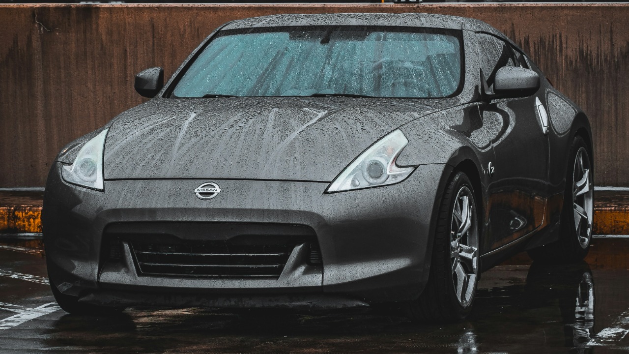 a silver sports car parked in a parking lot
