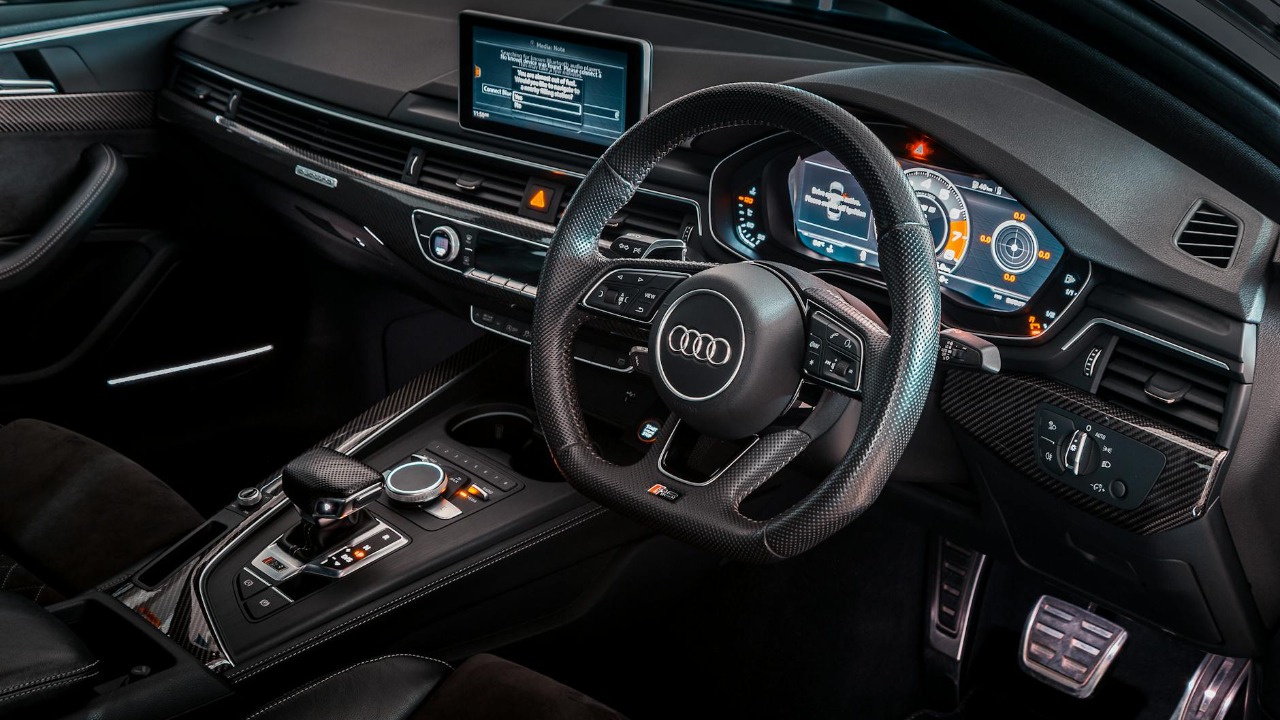 Explore the sleek design and advanced technology of this luxurious Audi car interior.