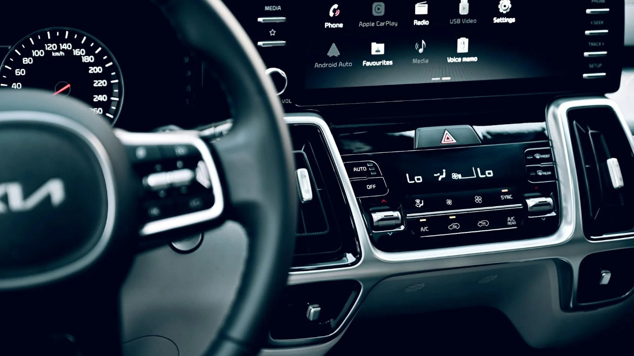 Close-up view of a luxury car's dashboard featuring a modern touchscreen display and advanced features.