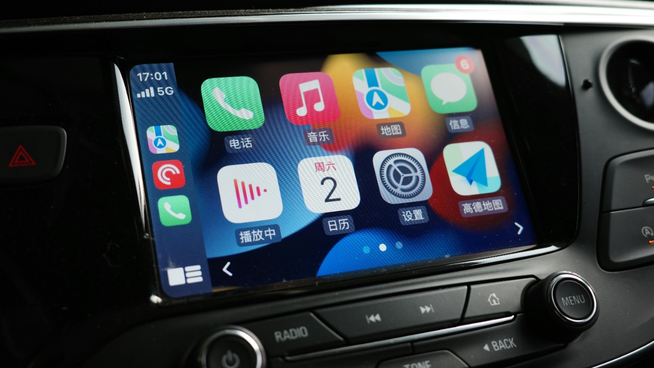 a car dashboard with various app icons on it
