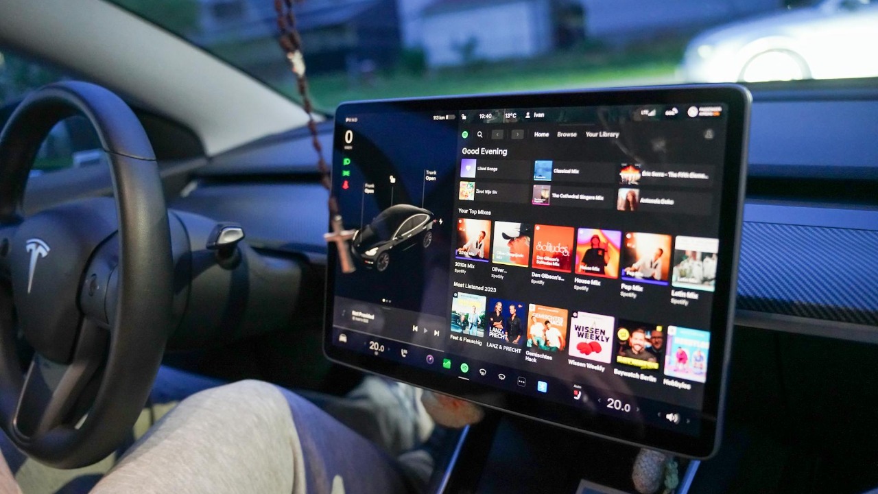 Close-up of a Tesla's digital dashboard showcasing entertainment options in Garešnica.