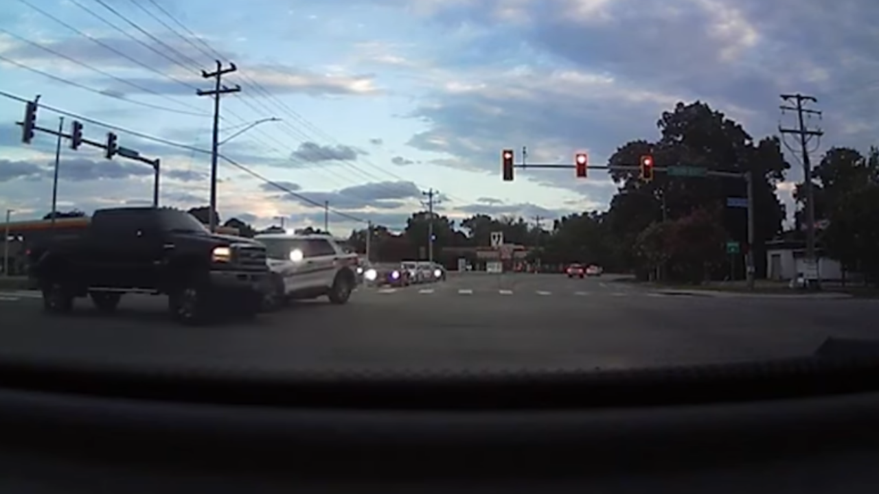 Dash cam shows police cruiser flip after colliding with a pickup truck mid-intersection