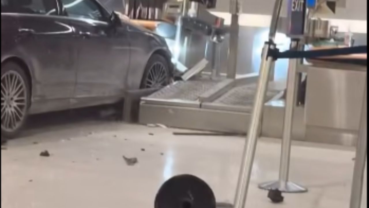Six hurt after car crashes into Detroit-area airport entrance