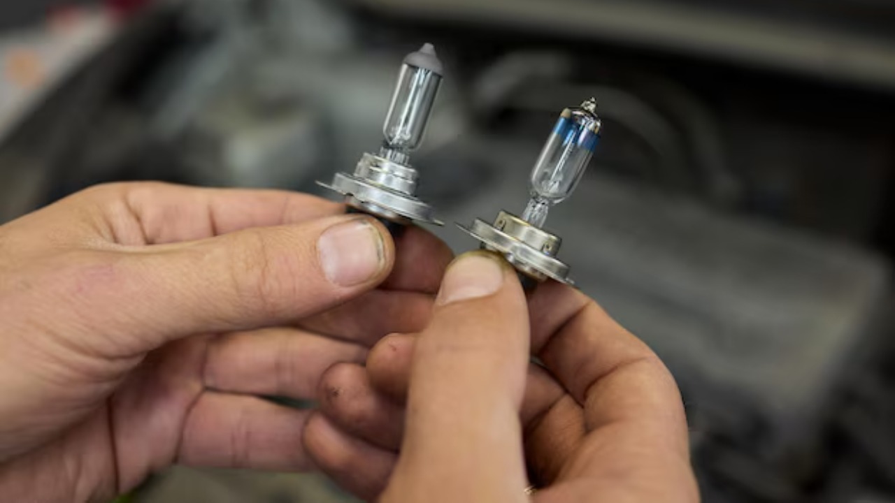 I replaced my headlights with factory bulbs, but the inspection station said they were “aftermarket spec”