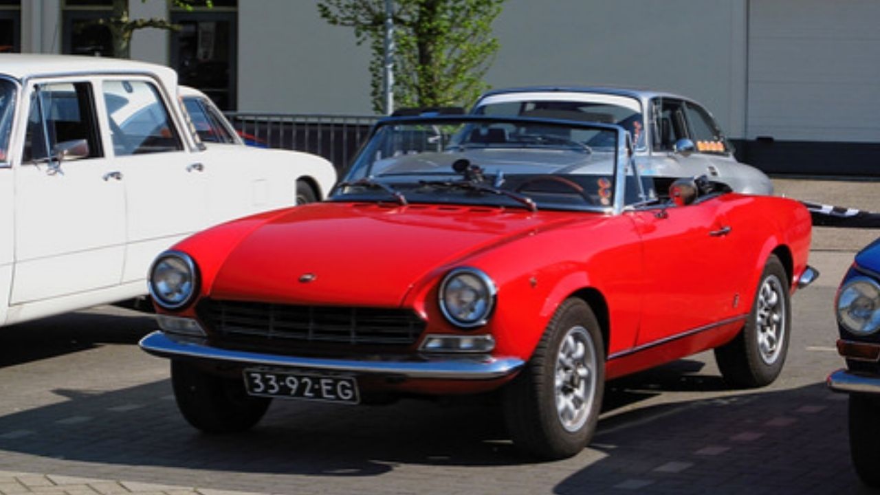A woman says her husband kept working on a 1968 Fiat 124 Sport Spider, then she realized why