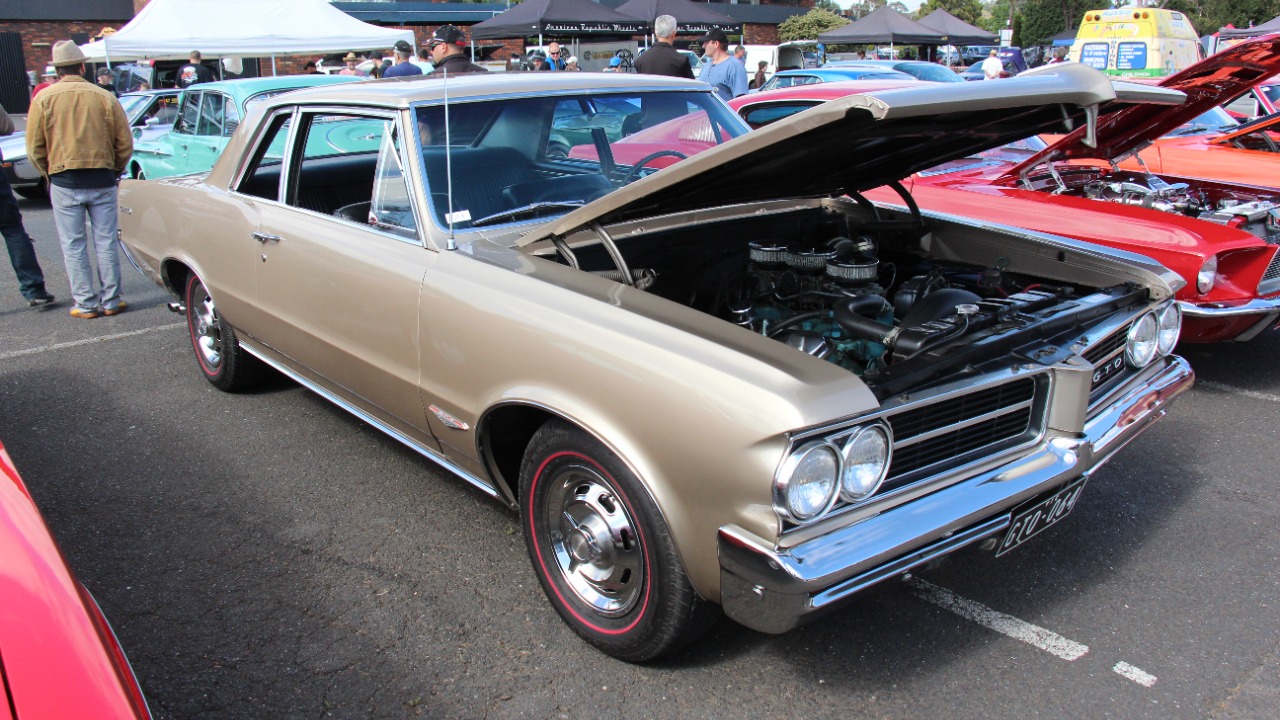 Pontiac’s 1964 GTO launched the muscle car era with a 348-hp V8
