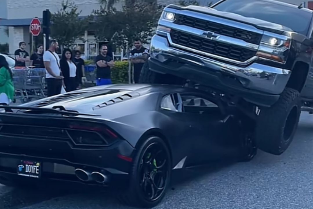 Nothing Says generational wealth quite like parking a Chevrolet Silverado directly on top of your Lamborghini