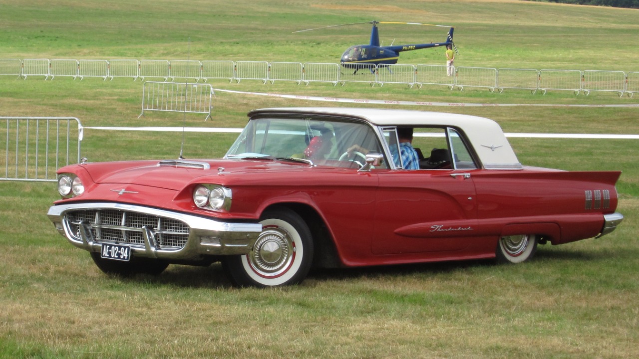 A red 1960 Ford Thunderbird hardtop