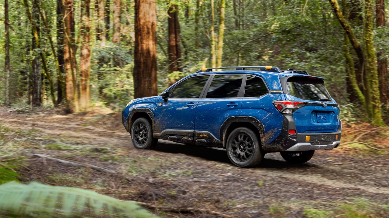 A 2027 Subaru Forester Wilderness on a forest trail, from the Forester Wilderness Hybrid announcement