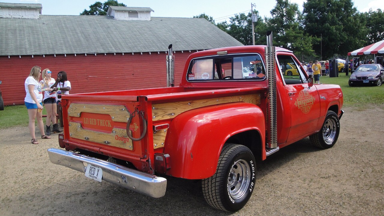 The rear of a 1978 Dodge Li'l Red Express showing the stepside bed and twin chrome exhaust stacks