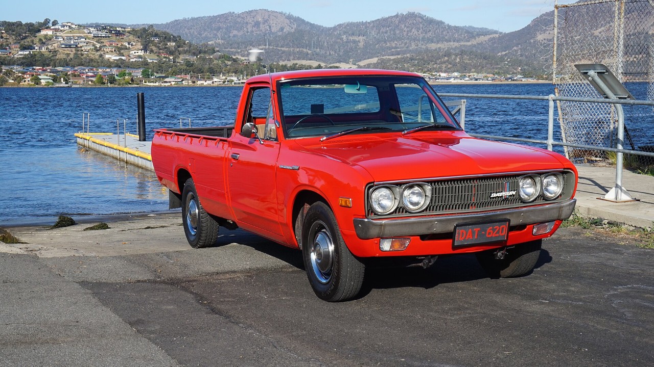 A red Datsun 620 pickup in Tasmania, Australia