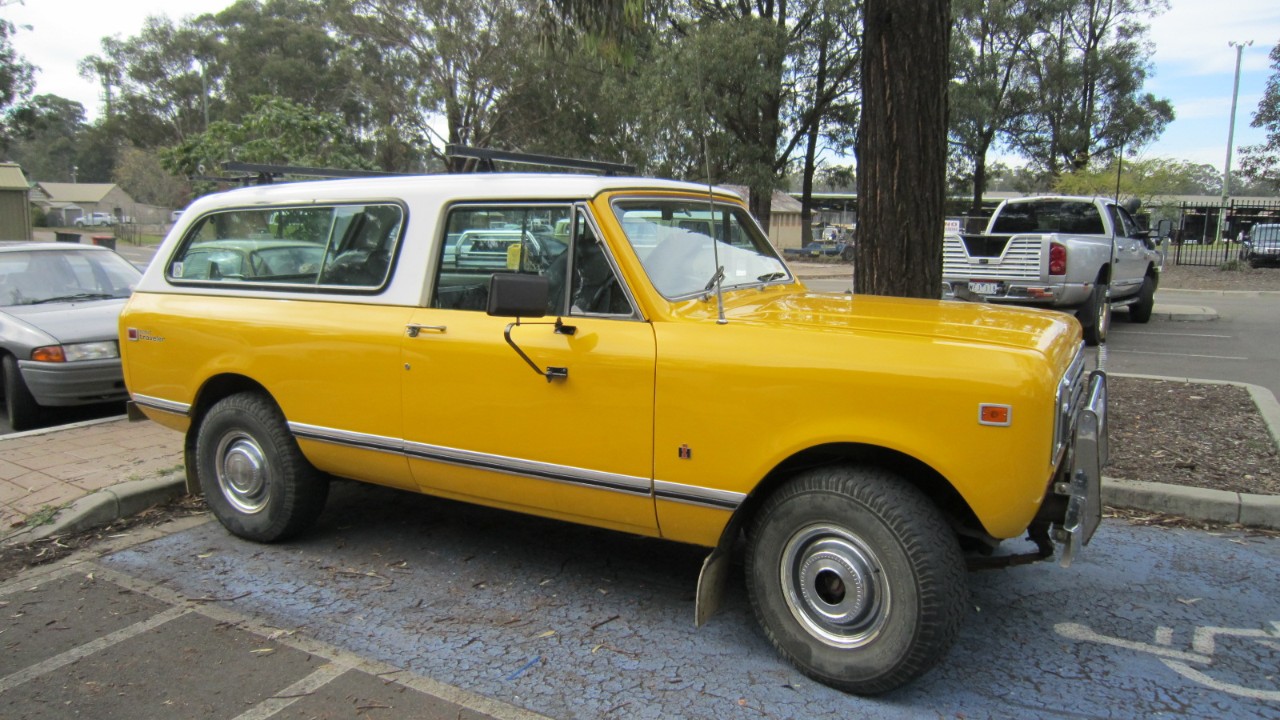 A yellow International Scout Traveler, the long-wheelbase International Scout wagon
