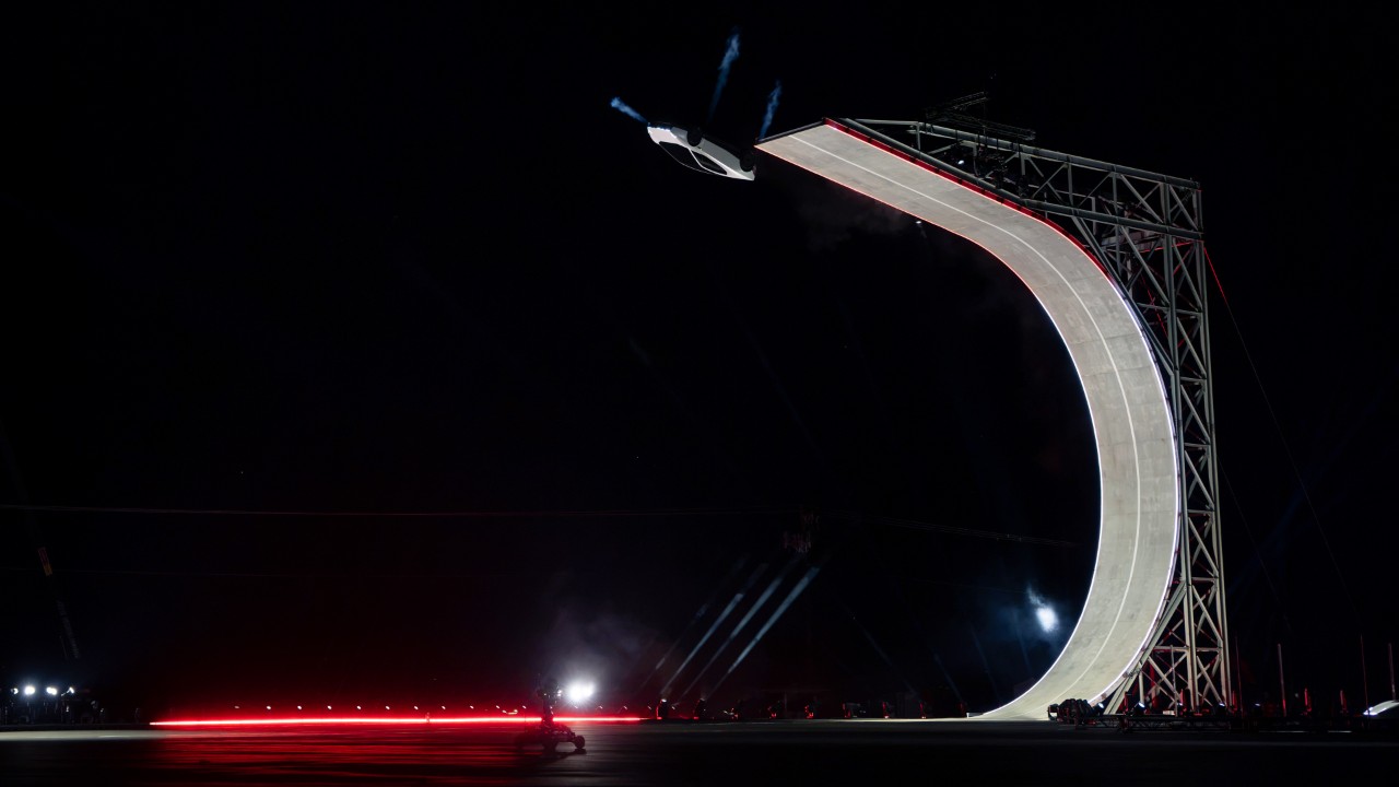 The new Tesla Roadster leaving a curved ramp in a Tesla press photo of its reveal stunt