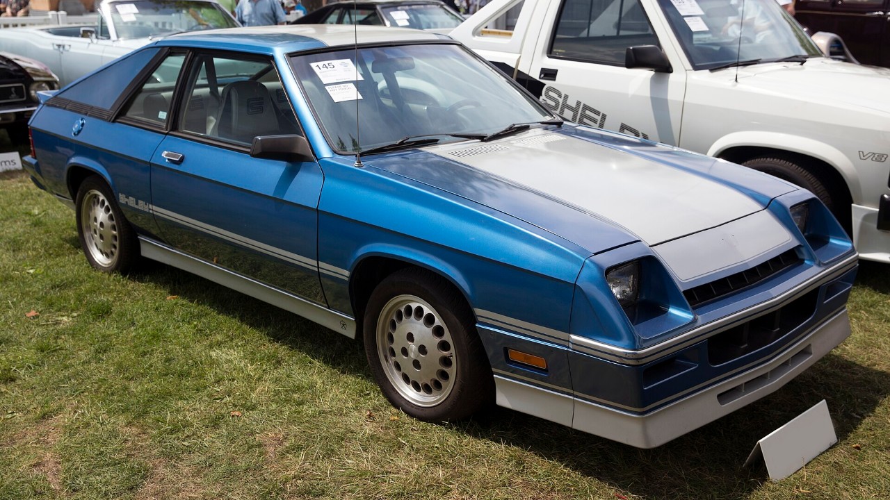 A blue and silver Dodge Shelby Charger