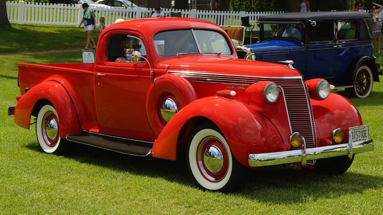 A red 1937 Studebaker Dictator Coupe Express