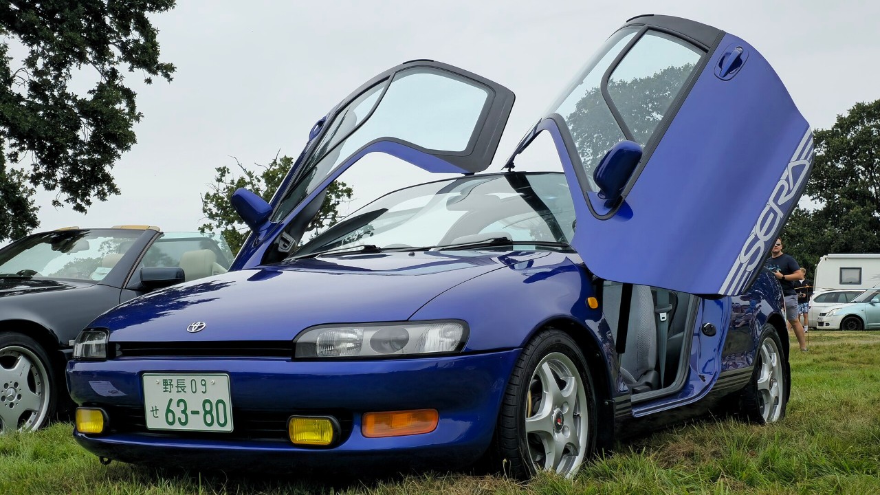 A Toyota Sera with its butterfly doors open