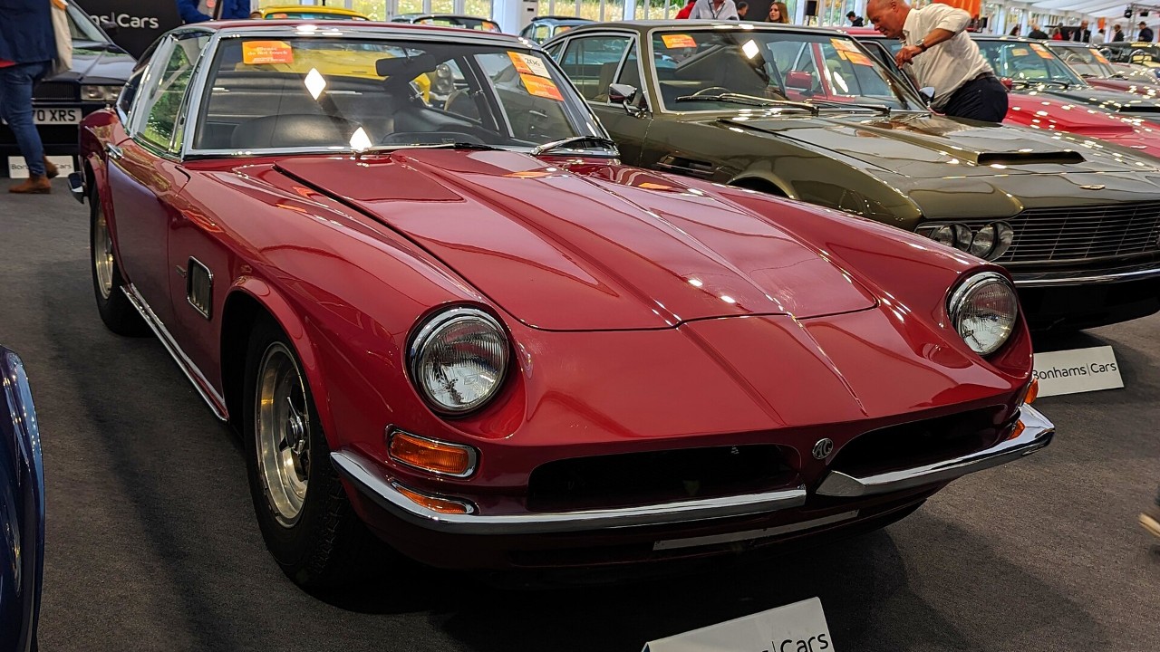 A red 1969 AC 428 Frua convertible
