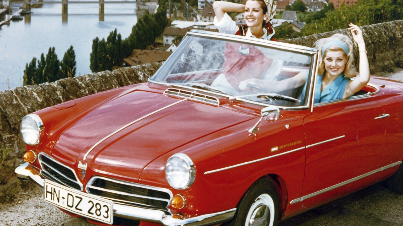A red NSU Wankel Spider with its top down in a 1960s Audi archive photo