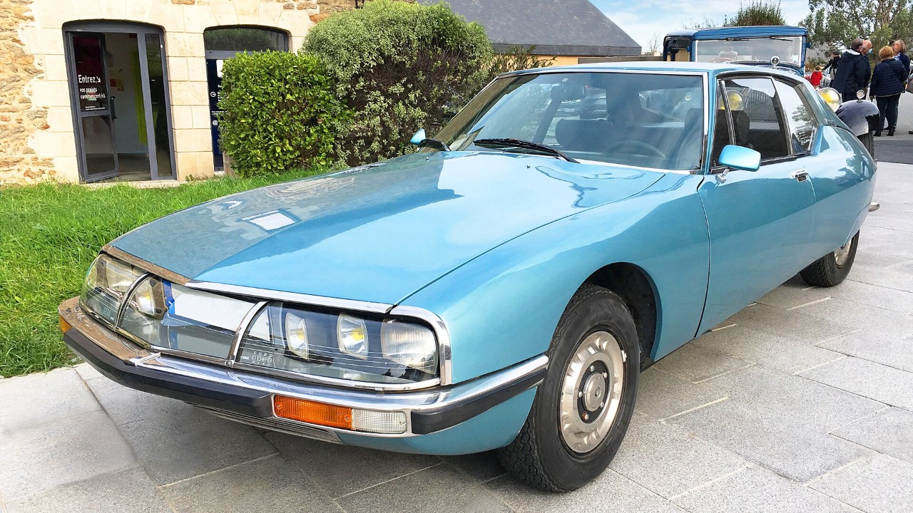 A light blue Citroën SM, front three-quarter view